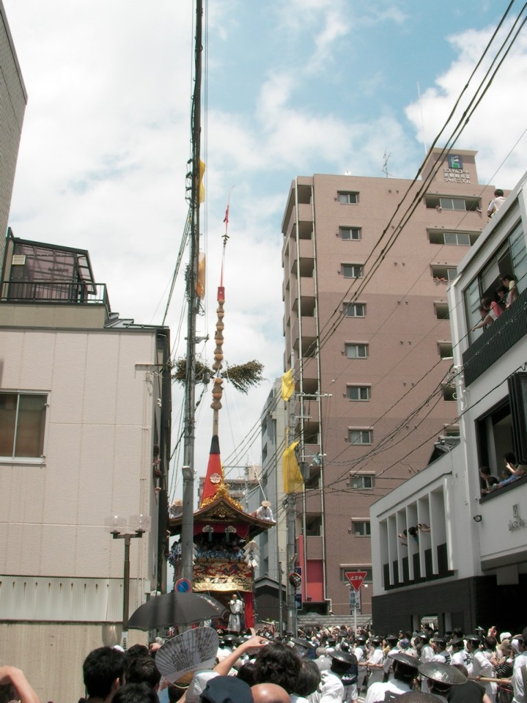 Here comes a big one—note the 12-story building it's passing by